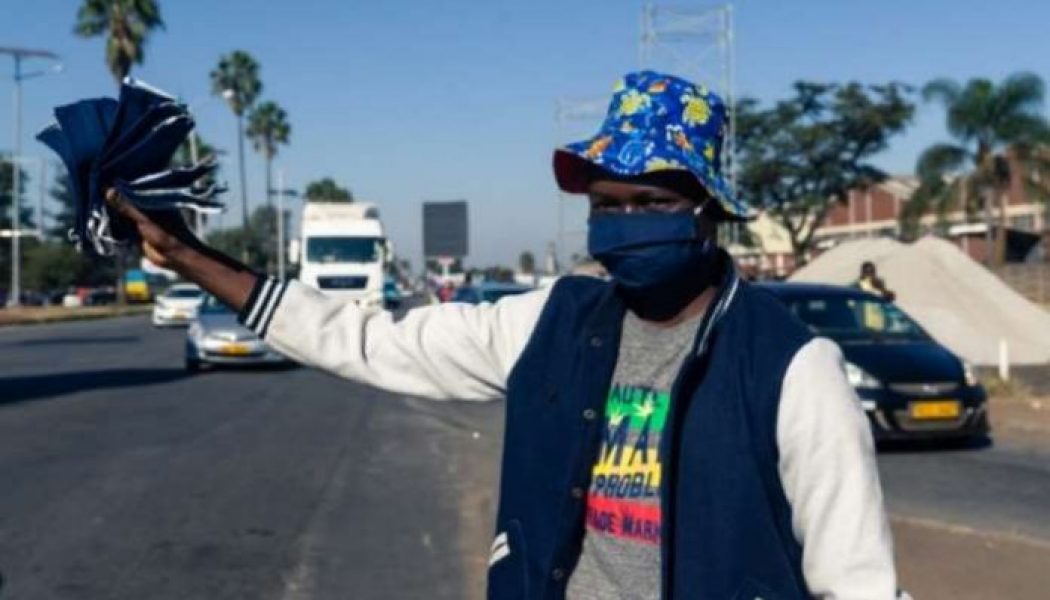 Zimbabwe street vendors sell cloth masks to make ends meet