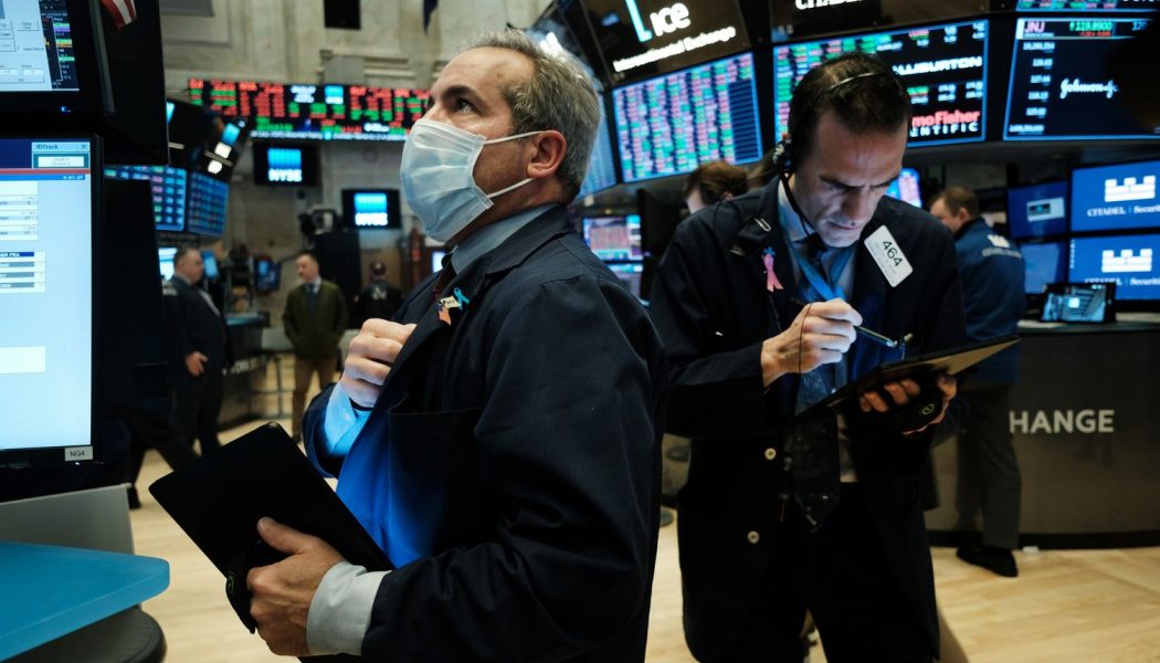 Dow sinks 1,600 as virus cases rise, deflating optimism