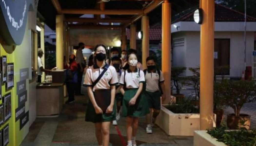 Pupils return to school in Singapore