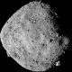 A NASA spacecraft is poised to snag the largest sample of rocks from an asteroid ever