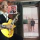 King Crimson’s Robert Fripp Performs Black Sabbath’s “Paranoid” as Wife Toyah Sings and Dances Behind Bars: Watch