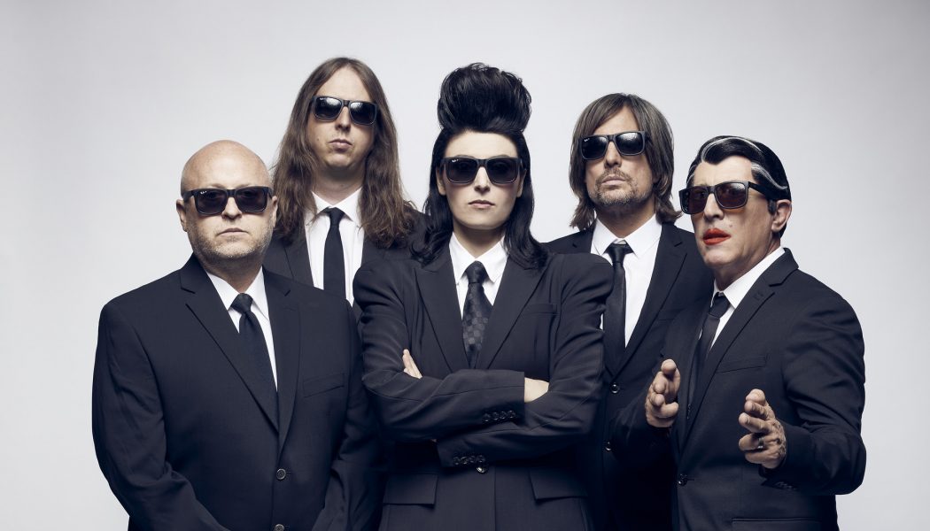 Puscifer Are Suited Up in ‘Fake Affront’ Video