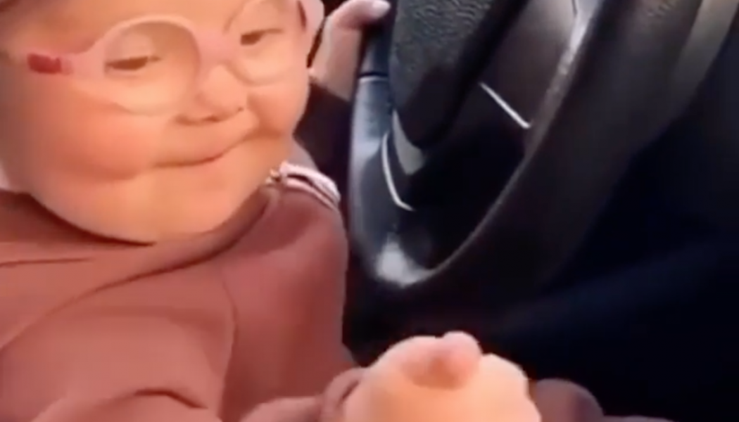 Here is a Baby Fist-Pumping to a Tiësto Track Behind the Wheel of a BMW