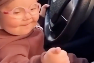 Here is a Baby Fist-Pumping to a Tiësto Track Behind the Wheel of a BMW