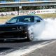 Dodge Challenger Hellcat Leaves Car Event, Immediately Tips Over Chevy Silverado
