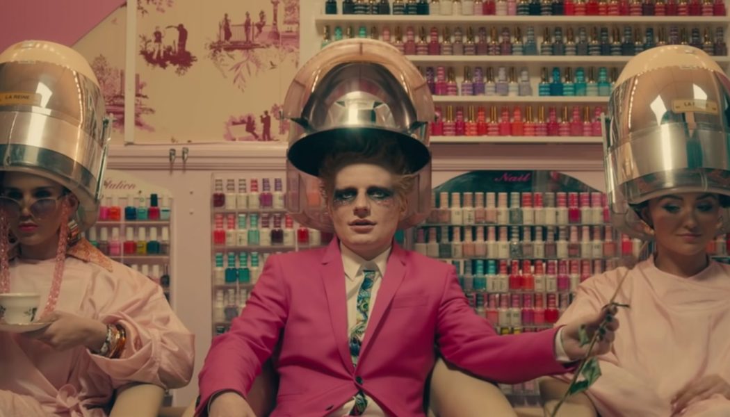 Ed Sheeran Channels Elton John in Feathers, Sequins and Tight Silver Trousers to Hype ‘Shivers’ Single