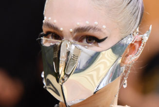 Grimes Trolls Paparazzi with Karl Marx Photoshoot