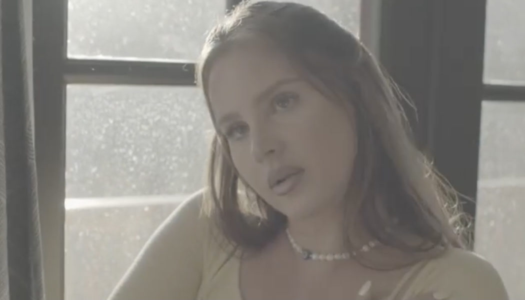 Lana Del Rey Meditates in an Emergency on Blue Banisters