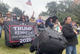 QAnon Believers, Still Waiting in Dallas, Sing “Take Me Home, Country Roads” to JFK Jr.: Watch