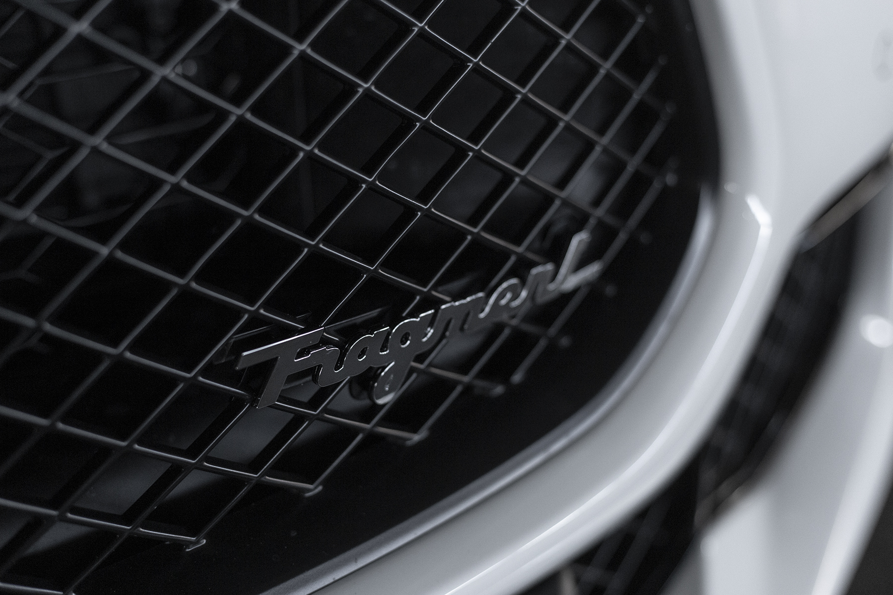 fragment design x Maserati Ghibli Open Road Review Hiroshi Fujiwara branding black white panda