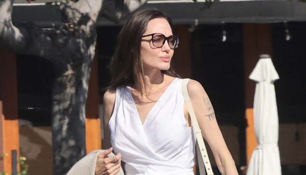 Angelina Jolie Wore Flats With Summer’s Prettiest (and Most Uncomplicated) Dress