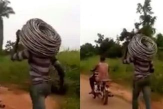 Cable thief made to run with a bike as punishment in Benin, Edo State