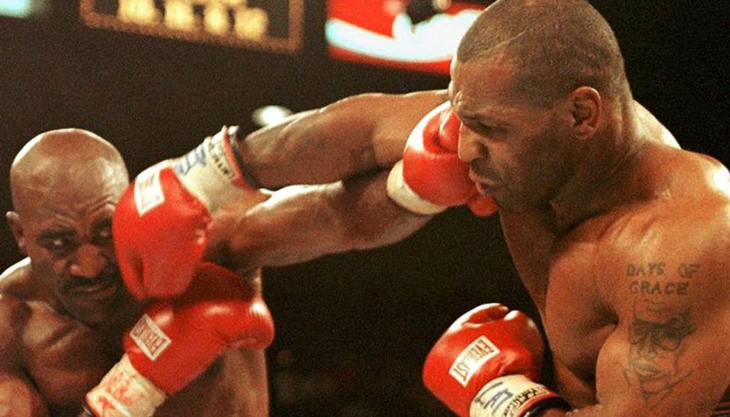 Evander Holyfield’s Gloves From Infamous Ear-Biting Fight With Mike Tyson Are up for Auction