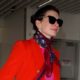 Anne Hathaway’s Airport Outfit Includes Puddle Pants and a Very ’90s Shoe Trend