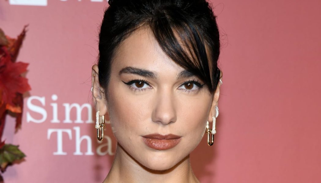 Dua Lipa Gives Wednesday Addams Halloween Costume an Edgy Update in Cutout Shirt