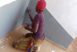 PHOTOS: LASPOTECH Student Goes Viral After Spotted Painting Building As Side Hussle Instead Of Urgent 2k