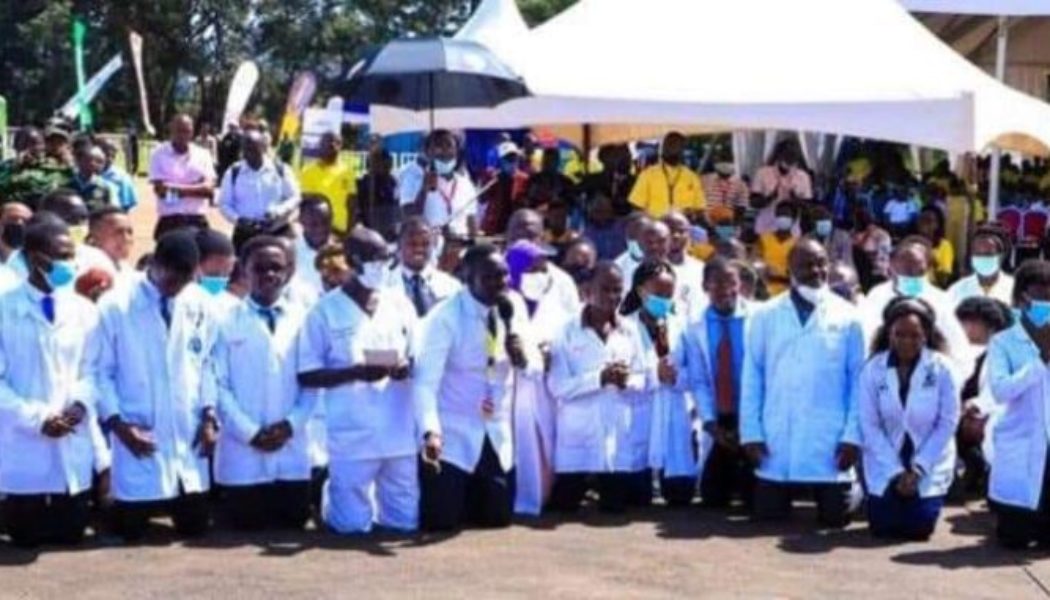 Ugandan doctors kneel to appeal to President Museveni, 78, to contest for the 7th time