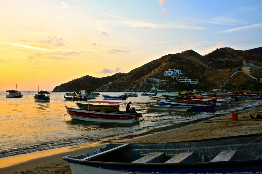 Boats on the beach of Taganga at sunset