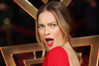 Margot Robbie’s Red Gown Is Formal at the Front and a Party at the Back
