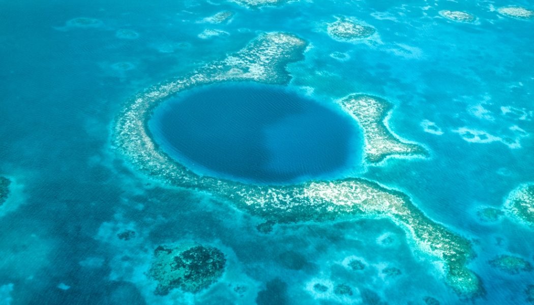 What is the best way to see the Blue Hole of Belize?
