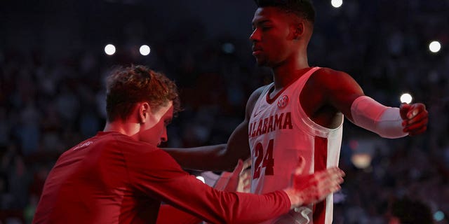 Brandon Miller of the Crimson Tide is patted down by a teammate during player introductions before the Kentucky Wildcats game at Coleman Coliseum on Jan. 7, 2023, in Tuscaloosa, Alabama.
