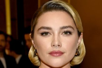 Florence Pugh Is Bringing the Peplum Back in a Red Corseted Gown and Puss in Boots Hat