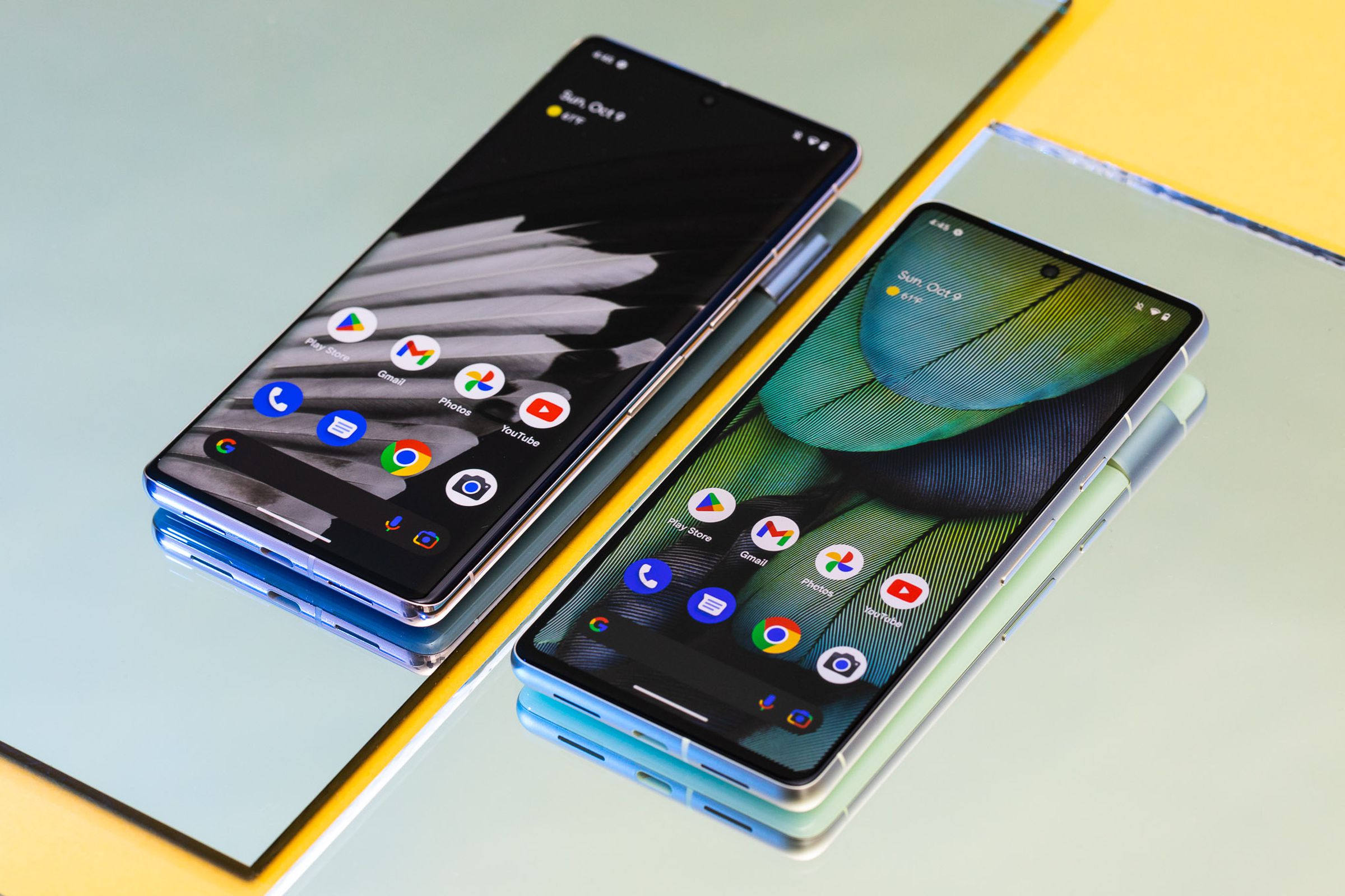 Pixel 7 and 7 Pro on a flat surface with screens facing up