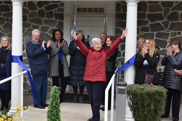 Jeanne Beacher, the niece of Surrey's founder Jeanne LaRouche, is all smiles as she cuts the ribbon at the grand opening of The Center for Healthy Living Delaware County in Broomall on Friday. She is surrounded by, left to right, Jill Whitcomb, Surrey President and CEO; Kevin OBrien Surrey board member; Dr. Monika Taylor, Delaware County Council; Barbara Nicolardi, COSA; Andy Signore Surrey, board chair; Maureen Brennan Miller, Surrey board member; Drew Bilotta, Surrey board member; Karen Coley, Surrey board member; and Kathy Henderson, Surrey Director Delaware County. (COURTESY PHOTO)