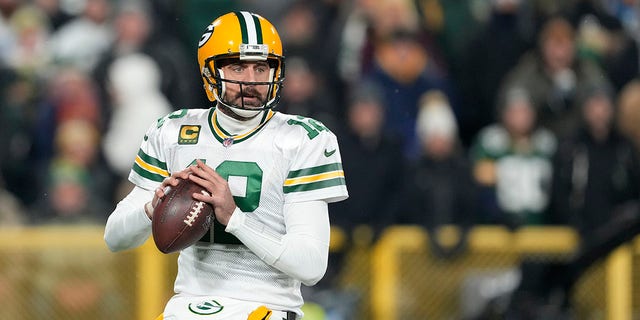 Aaron Rodgers, #12 of the Green Bay Packers, looks to throw a pass against the Tennessee Titans during the first quarter in the game at Lambeau Field on November 17, 2022, in Green Bay, Wisconsin. 