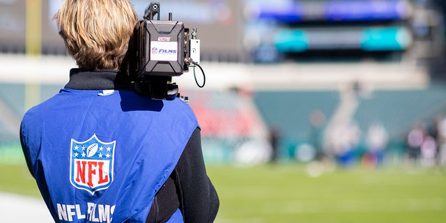 An NFL Films cameraman films prior to a game between the Chicago Bears and Philadelphia Eagles at Lincoln Financial Field Nov. 3, 2019, in Philadelphia.