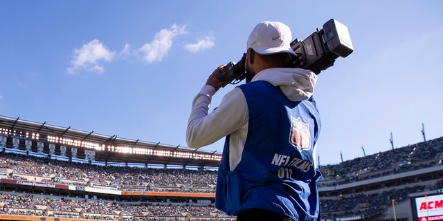 An NFL Films cameraman films a game between the Chicago Bears and Philadelphia Eagles at Lincoln Financial Field Nov. 3, 2019, in Philadelphia.