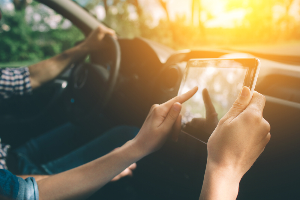 A passenger uses a table during a road trip