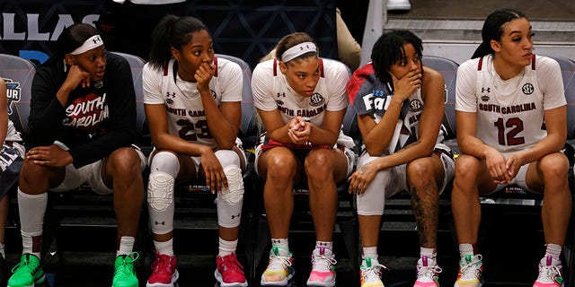 The South Carolina Gamecocks bench reacts in the closing seconds of the fourth quarter against the Iowa Hawkeyes during the 2023 NCAA Tournament Final Four at American Airlines Center March 31, 2023, in Dallas, Texas.