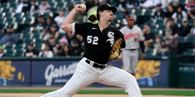 Mike Clevinger, #52 of the Chicago White Sox, throws a pitch during the first inning against the Baltimore Orioles at Guaranteed Rate Field on April 14, 2023, in Chicago, Illinois. 