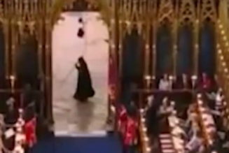 Cloaked figure runs past Westminster Abbey during coronation | Lifestyle | Independent TV - The Independent
