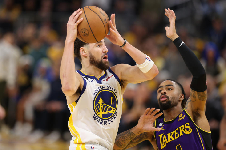 Golden State Warriors guard Klay Thompson drives against D'Angelo Russell of the Los Angeles Lakers during the fourth quarter in Game 2 of the Western Conference semifinal series at Chase Center in San Francisco on May 4, 2023. (Ezra Shaw/Getty Images)
