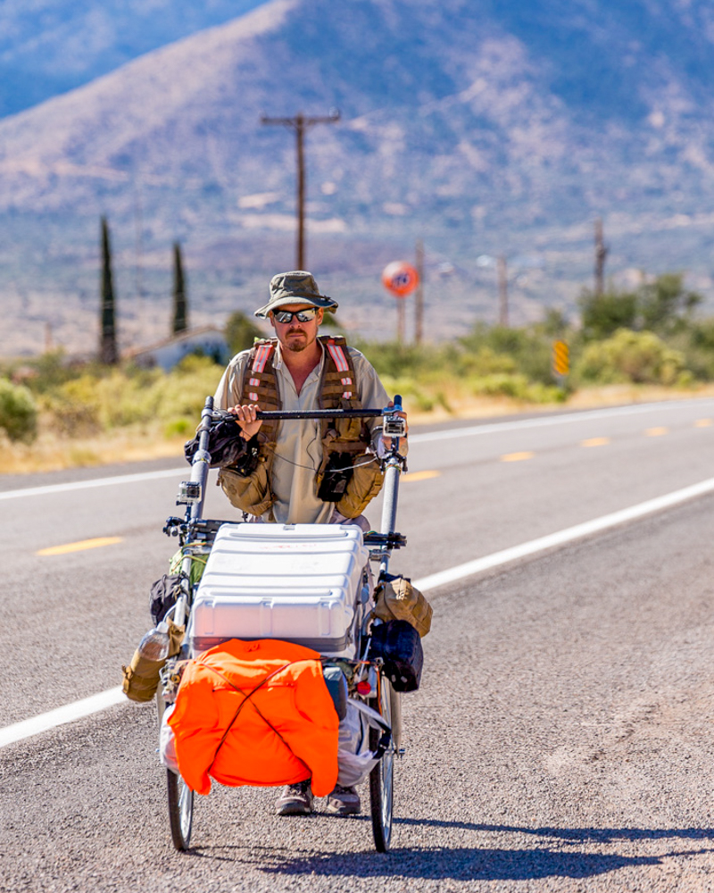 Karl Bushby walkign along a road