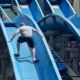 ‘Heroic’ father scales theme park water slide to rescue stuck daughter