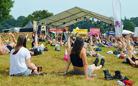 A yoga class takes place during the Latitude Festival 