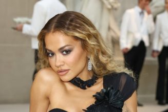 Rita Ora Looks Red Hot in a Plunging, See-Through Lace Dress Over String Lingerie