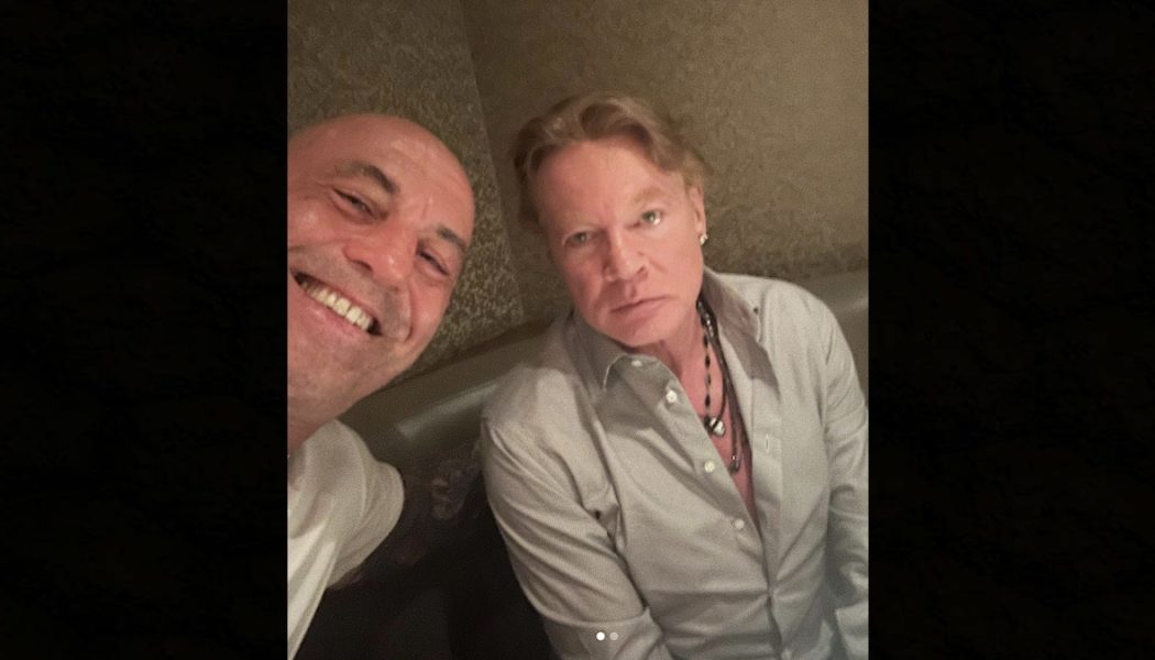 Axl Rose looks absolutely thrilled by Joe Rogan selfie at restaurant