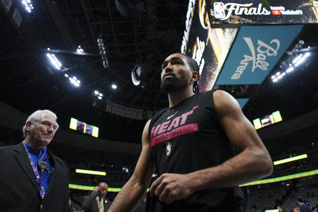 Miami Heat guard Gabe Vincent, right, walks off the court before Game 5 of basketball's NBA Finals against the Denver Nuggets, Monday, June 12, 2023, in Denver. (AP Photo/Jack Dempsey)