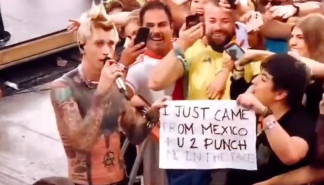 Machine Gun Kelly fulfills fan's wish to be punched in the face