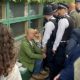 Wimbledon protesters arrested after delaying play with climate change demonstration during men’s singles match