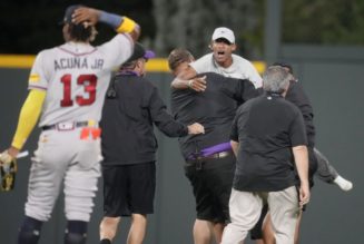 Braves star Ronald Acuna Jr. knocked over as fans run onto field in bizarre scene