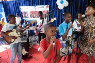 Haitian students play drums and strum guitars to escape hunger and gang violence