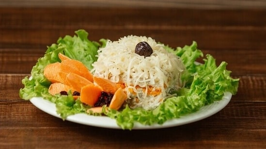 While having your favourite meal of dal-chawal-sabzi, be mindful of adding dal and veggies first before filling your plate with rice, as this will make you mindful about your portion size. "If you wish to take second helping of rice.. add dal and vegetables first then rice. This will help you control the portion size while adding fibre and protein to prevent insulin spikes," says Agarwal.(Freepik)