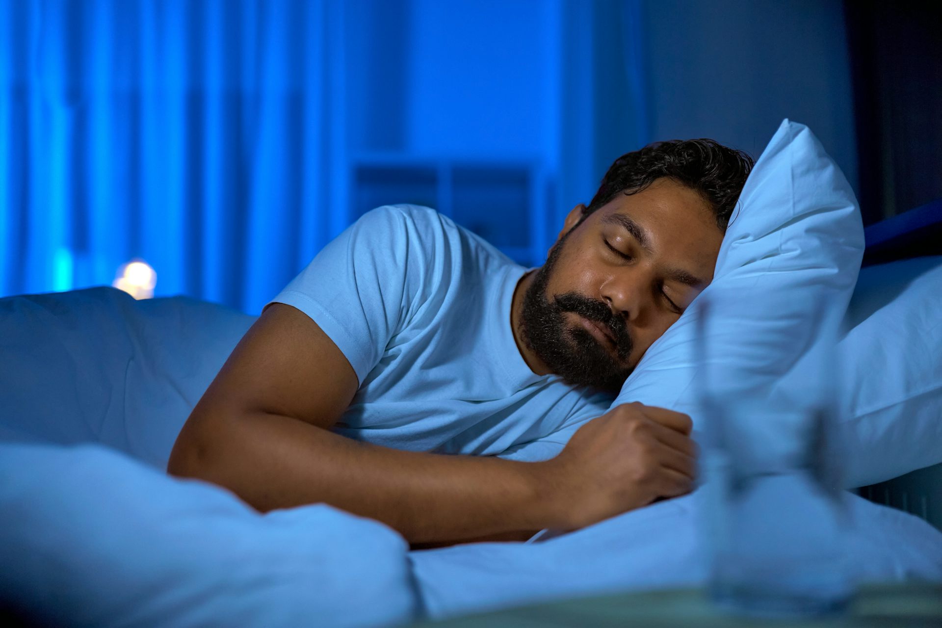 A man asleep in bed