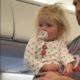 This toddler on a plane is all of us during holiday travel