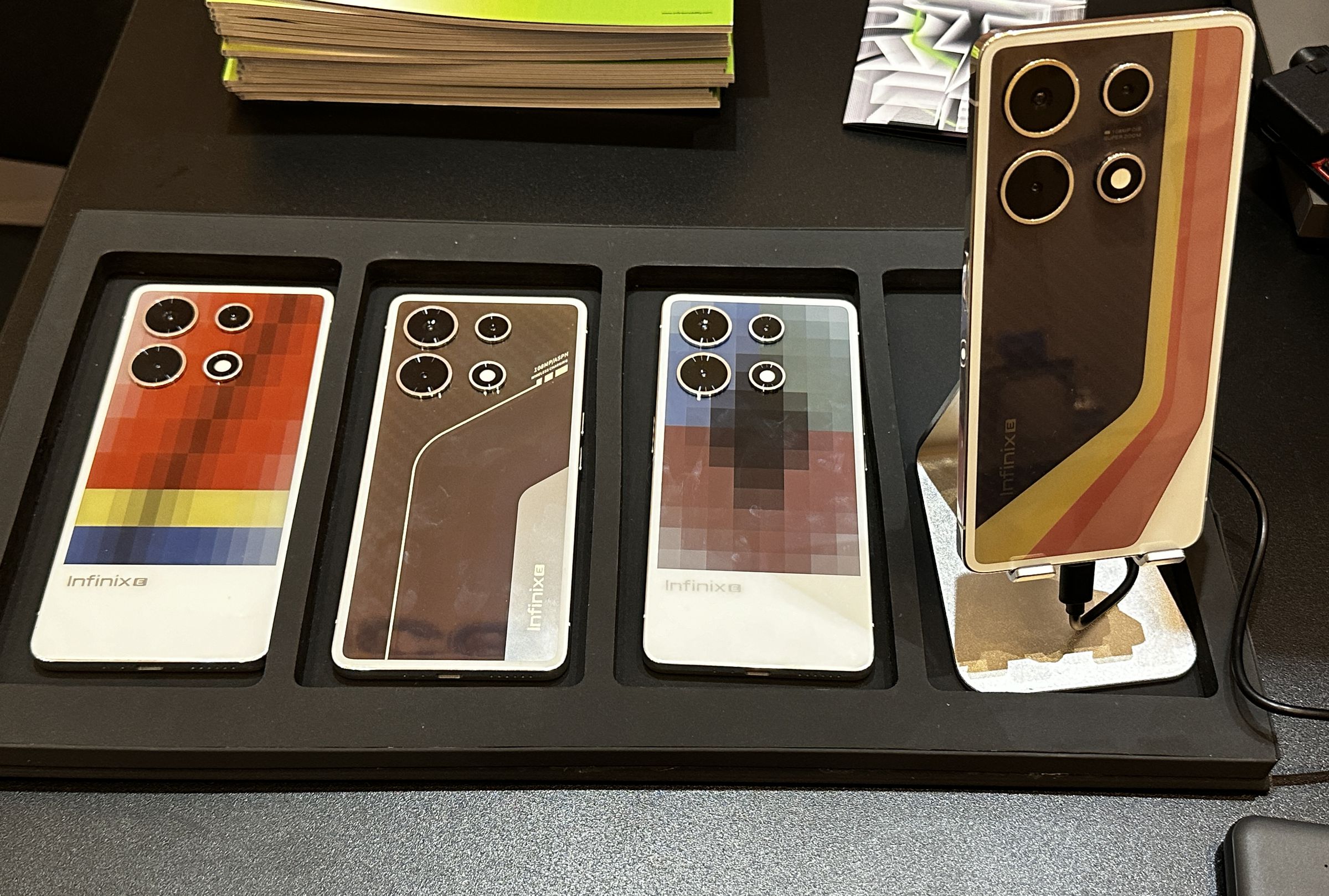 and image of four phones. They’re all covered in vibrant geometrical patterns.